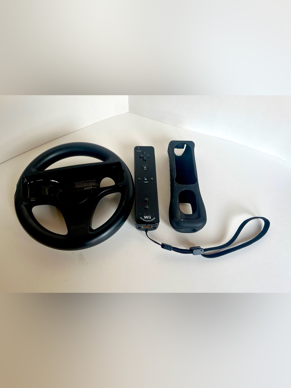 Nintendo Black Wii Remote Motion Plus with Wheel and Silicone Sleeve Bundle